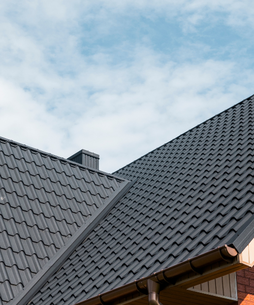 A close up of a roof with a sky background