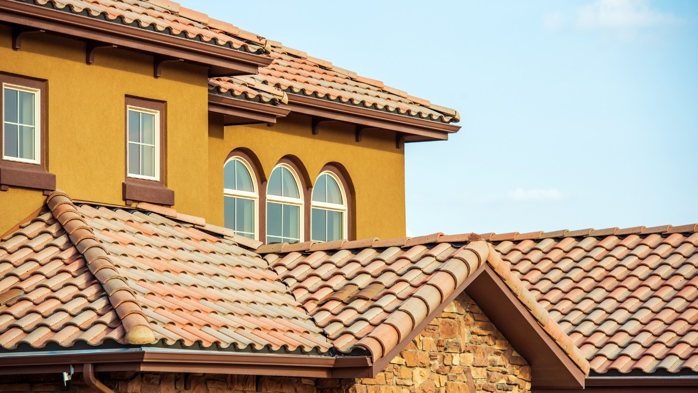 A yellow building with a red tiled roof