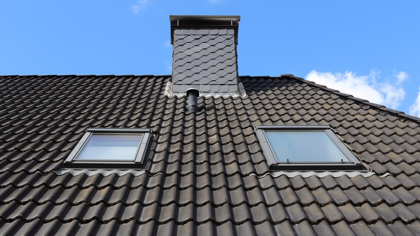 Two windows on the roof of a building